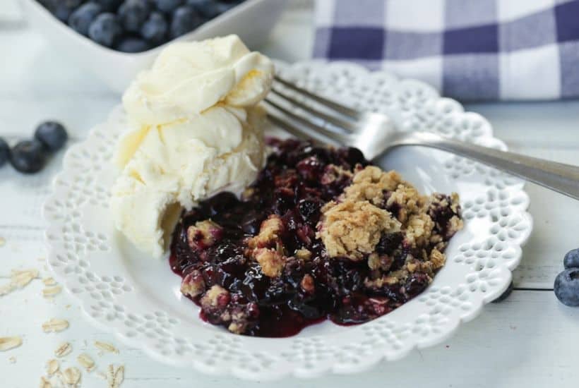 It's blueberry season! This easy blueberry crisp recipe it the perfect way to celebrate. This fruit crisp is a super simple summer dessert and perfect with a dollop of ice cream. #blueberrycrisp #blueberryrecipe #summerdessert