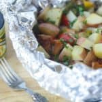Fire up the grill and make this Potato And Bacon Foil Packets recipe. This easy grilled side dish is a perfect summer recipe or camping recipe. And it has bacon in it! #foilpackets #potatoandbaconfoilpacket #campingrecipe #grillingrecipe #Ad #BTBGrillingRecipes #IC