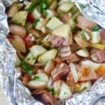 Fire up the grill and make this Potato And Bacon Foil Packets recipe. This easy grilled side dish is a perfect summer recipe or camping recipe. And it has bacon in it! #foilpackets #potatoandbaconfoilpacket #campingrecipe #grillingrecipe #Ad #BTBGrillingRecipes #IC