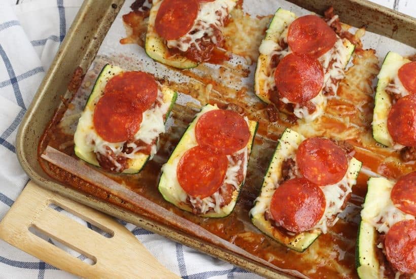 Ready for a delicious low-carb meal idea? This Stuffed Pizza Zucchini Boats recipe is a perfect low carb dinner option or side dish. This easy zucchini recipe is perfect for summer. #zucchini #lowcarbrecipe #zucchiniboats