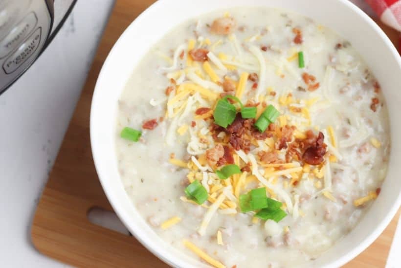 Warm up with a comforting bowl of this tasty Instant Pot Cheeseburger Soup. This hearty Instant Pot soup recipe is made from scratch and ready in no time. #instantpotrecipe #soup #cheeseburgersoup