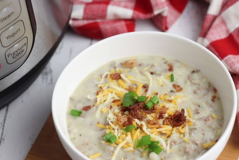 Warm up with a comforting bowl of this tasty Instant Pot Cheeseburger Soup. This hearty Instant Pot soup recipe is made from scratch and ready in no time. #instantpotrecipe #soup #cheeseburgersoup
