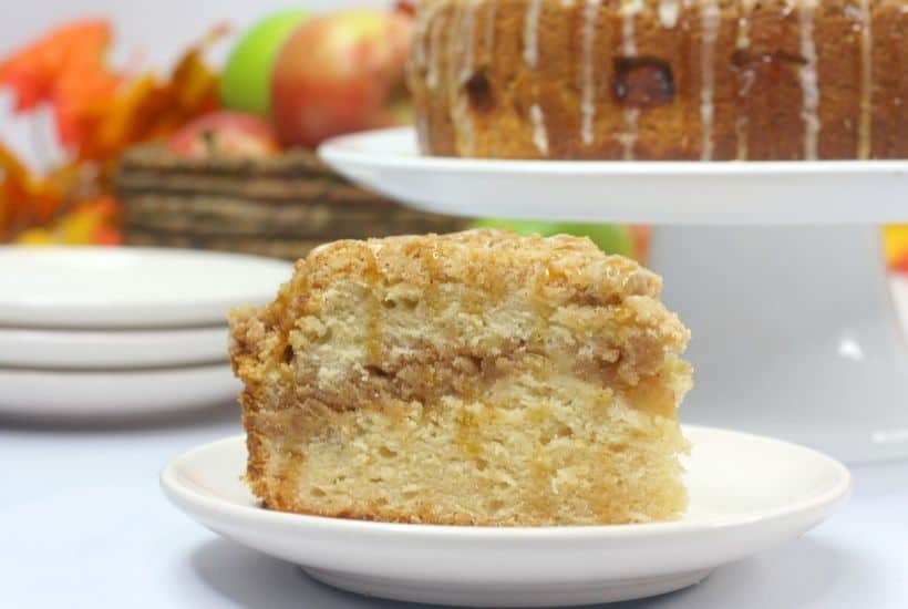Salted Caramel Apple Cake is moist, fluffy and loaded with fresh sweet apples. It is then drizzled with a decadent salted caramel glaze. This apple cake recipe is a winner! #applecake #applecrumbcake #saltedcaramel #appledessert