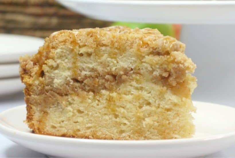 Salted Caramel Apple Cake is moist, fluffy and loaded with fresh sweet apples. It is then drizzled with a decadent salted caramel glaze. This apple cake recipe is a winner! #applecake #applecrumbcake #saltedcaramel #appledessert