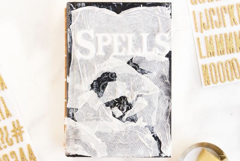 Cast a spell on your friends and family this Halloween. Create your own Halloween Spell Book with this easy craft tutorial. This Halloween craft is spellbinding! #halloweencraft #hocuspocus #halloweendecor