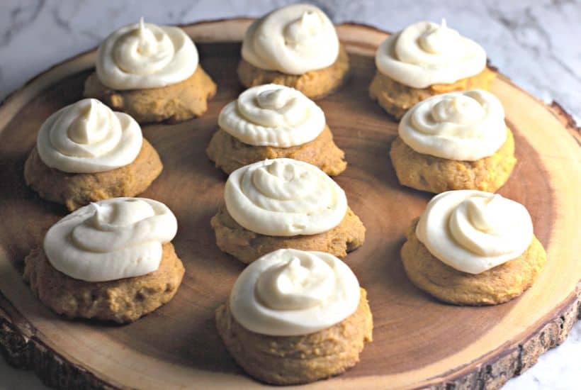 These Bakery Style Soft Pumpkin Cookies are soft and mildly sweet with just the right amount of pumpkin spice. The cream cheese icing is the perfect topping make this pumpkin cookie recipe a perfect fall treat. #pumpkincookies #pumpkinrecipe #falldessert #cookierecipe