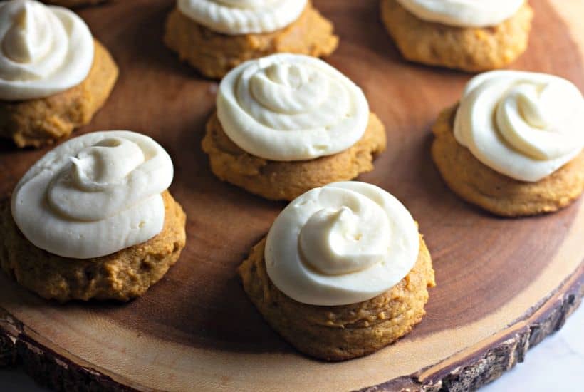 These Bakery Style Soft Pumpkin Cookies are soft and mildly sweet with just the right amount of pumpkin spice. The cream cheese icing is the perfect topping make this pumpkin cookie recipe a perfect fall treat. #pumpkincookies #pumpkinrecipe #falldessert #cookierecipe