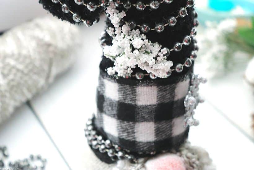 Gnomes are so popular right now. Celebrate the season with this DIY Buffalo Check Christmas Gnome is a fun Christmas craft you can make yourself. #Gnome #ChristmasGnome #ChristmasCraft