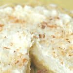 You can't go wrong with a slice of this luscious Coconut Cream Pie. This Best Coconut Custard pie recipe has a creamy coconut custard filling and topped with sweet whipped cream. All of this is nestled into a buttery, flaky pie crust. This easy pie recipe is perfect to serve all year long. #coconutcustardpie #pierecipe #easypierecipe #nobakedessert