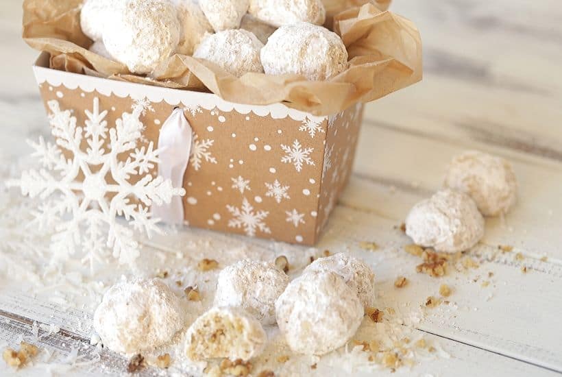 Whether you call them Mexican Wedding Cookies, Russian Tea Cakes or Snowball Cookies, these delicate buttery cookies, rolled in powdered sugar (with many different names) are a staple each year at Christmas. This easy 6-ingredient Christmas cookie is versatile too. Change up the flavoring or add-in ingredients and create a whole new cookie recipe. #mexicanweddingcookies #ChristmasCookies #cookierecipe #RussianTeaCakes