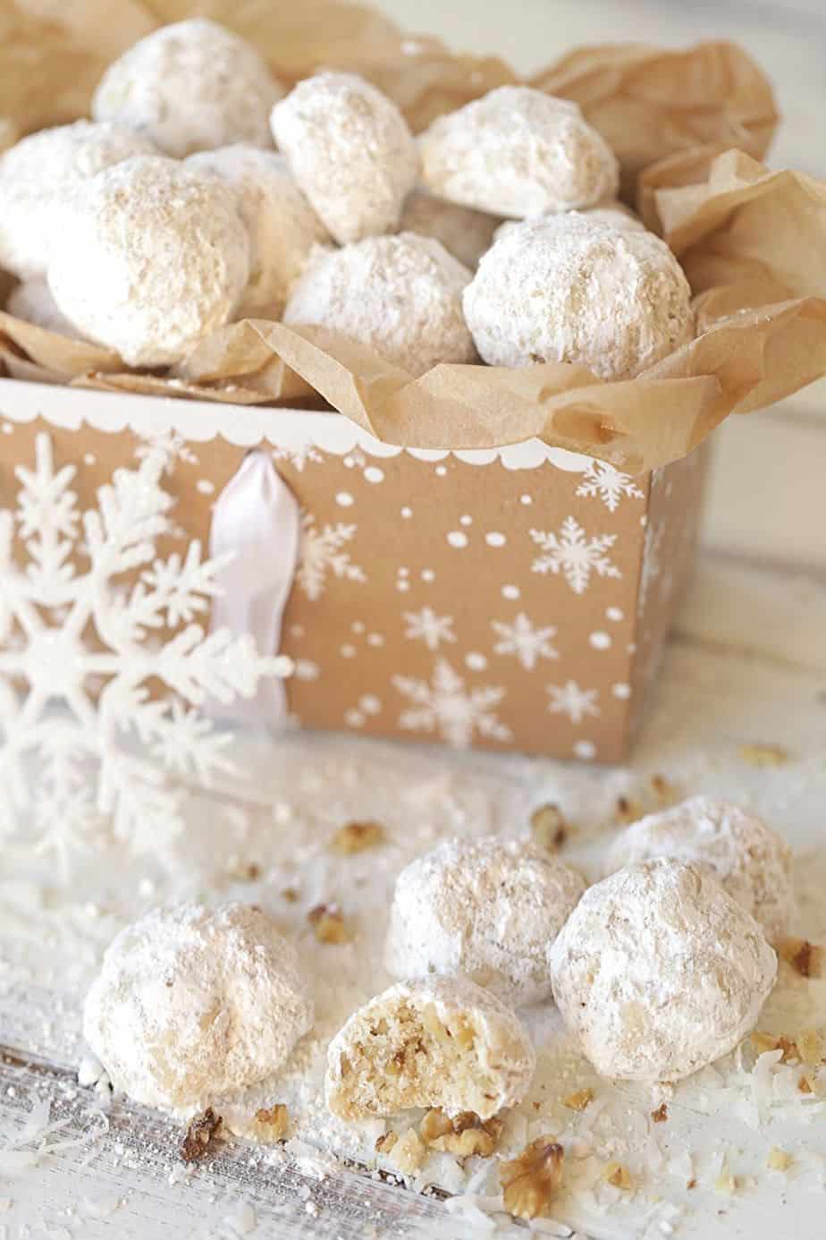 Whether you call them Mexican Wedding Cookies, Russian Tea Cakes or Snowball Cookies, these delicate buttery cookies, rolled in powdered sugar (with many different names) are a staple each year at Christmas. This easy 6-ingredient Christmas cookie is versatile too. Change up the flavoring or add-in ingredients and create a whole new cookie recipe. #mexicanweddingcookies #ChristmasCookies #cookierecipe #RussianTeaCakes