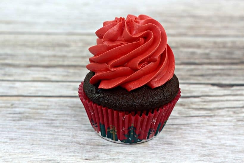 Make this Christmas a Disney Christmas. These adorable Mickey Mouse Santa Cupcakes are the perfect holiday Disney snack to celebrate Christmas. This Disney dessert is so easy and festive. Add a cute Mickey Santa hat to these decorated Christmas cupcakes. #disneysnack #christmascupake #disneyfood