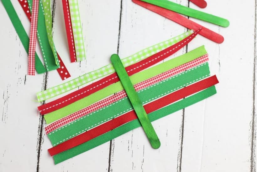 These Ribbon Tree Ornaments are a fun Christmas craft to make. Use any colorful ribbon to make these easy ornaments for your Christmas tree. This is a fun Christmas craft for kids too. #ornaments #ChristmasTree #ChristmasCraft