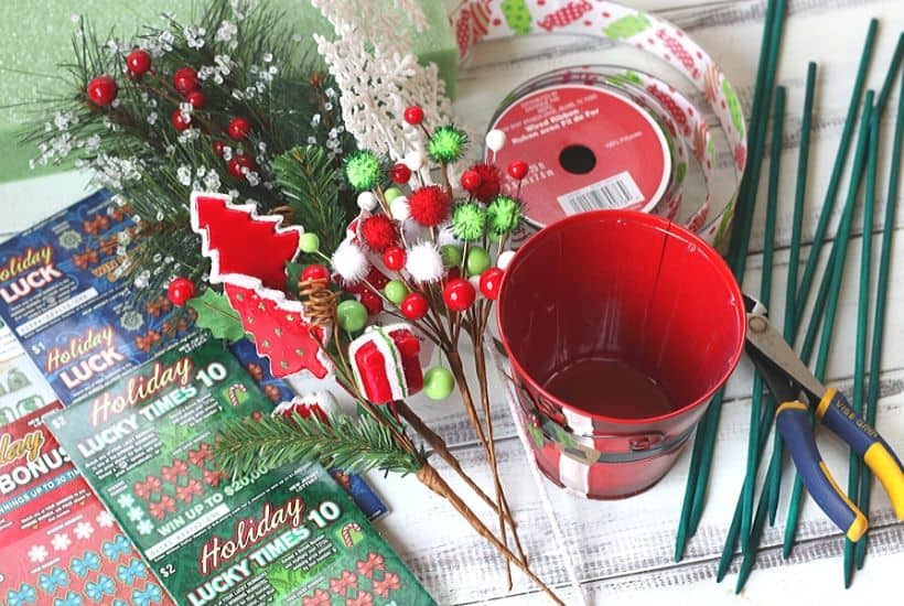 Ring in the holiday season with this easy gift idea. Share some luck this holiday season by giving this DIY New Jersey Lottery Scratch Off Ticket Christmas Arrangement. This is an easy DIY Christmas craft. #ad #BestGifts, #TheGiftThatKeepsOnGiving #NewJerseyLottery #NJLotteryHoliday