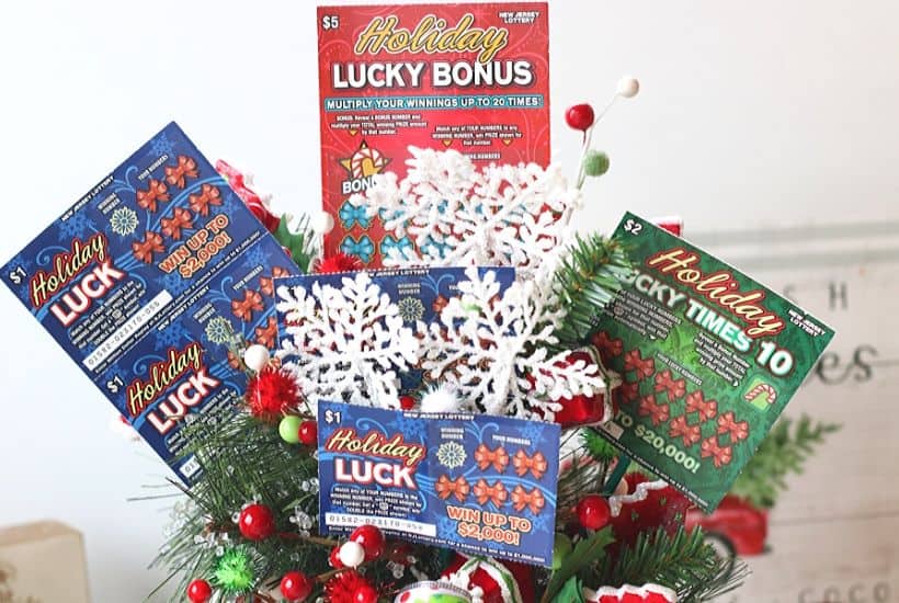 Ring in the holiday season with this easy gift idea. Share some luck this holiday season by giving this DIY New Jersey Lottery Scratch Off Ticket Christmas Arrangement. This is an easy DIY Christmas craft. #ad #BestGifts, #TheGiftThatKeepsOnGiving #NewJerseyLottery #NJLotteryHoliday