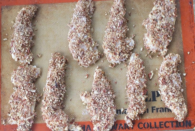 This baked Pecan Crusted Chicken recipe has a whole lot of flavor and a delicious pecan crunch. Enjoy these chicken tenders as is, with dipping sauce or on top of a salad.