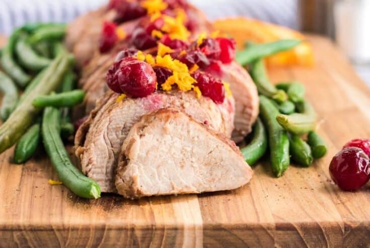 This Slow Cooker Pork Tenderloin With Cranberries & Orange is a delicious fix it and forget it holiday Crock Pot recipe. 