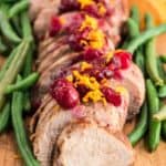 This Slow Cooker Pork Tenderloin With Cranberries & Orange is a delicious fix it and forget it holiday Crock Pot recipe.