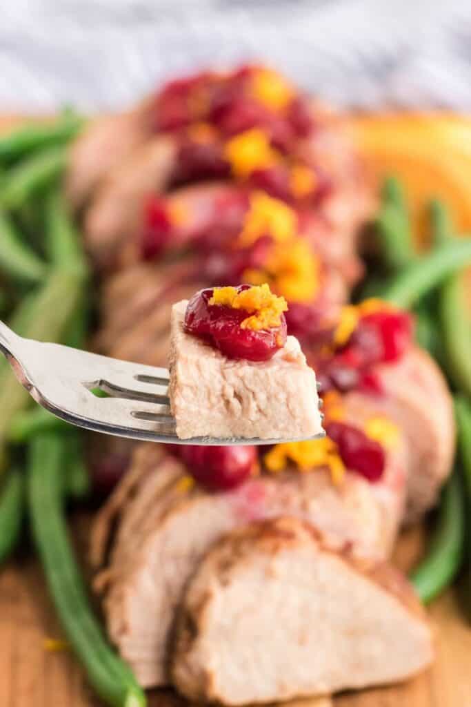 This Slow Cooker Pork Tenderloin With Cranberries & Orange is a delicious fix it and forget it holiday Crock Pot recipe.