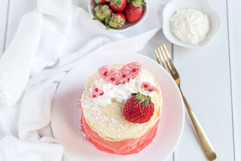 These Pink Ombre Pancakes are the perfect homemade Valentine's Day Pancake Recipe. Your family will love these light and fluffy pancakes. Share some love and make easy pancake recipe can be served all year long. #valentinesdaypancakes #ombrepancakes