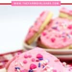 These soft and buttery Valentine Lofthouse Sugar Cookies are the perfect sweet treat. These sour cream cookies are topped with sweet frosting and sprinkles. This is an easy sugar cookie recipe that requires no rolling. You can make them for any season or holiday by just changing the color of the frosting. #sugarcookies #lofthousecookies #valentinesdayrecipe #partyidea