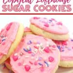 These soft and buttery Valentine Lofthouse Sugar Cookies are the perfect sweet treat. These sour cream cookies are topped with sweet frosting and sprinkles. This is an easy sugar cookie recipe that requires no rolling. You can make them for any season or holiday by just changing the color of the frosting. #sugarcookies #lofthousecookies #valentinesdayrecipe #partyidea