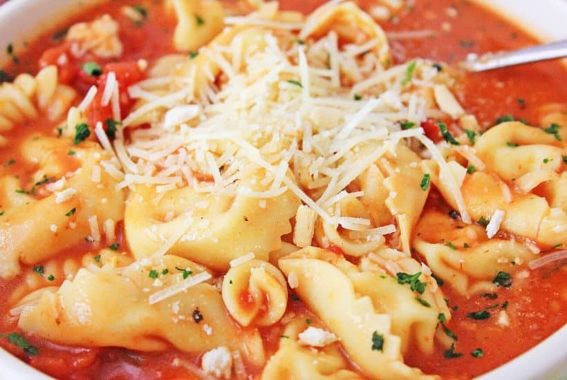 Warm yourself up with a bowl of this Instant Pot Chicken Parmesan Soup. This easy instant pot soup is a delicious comfort food recipe. This easy Chicken Parm soup recipe will be a family favorite.