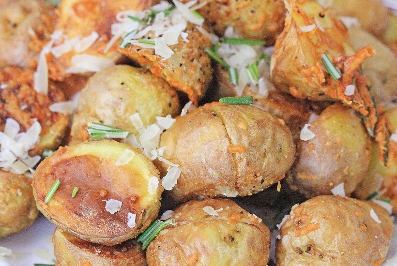 Lighten up your side dish routine with this easy Air Fryer Parmesan Rosemary Potatoes. This is a delicious weeknight or holiday side dish. We all love potato recipes and this potato recipe is quick and easy. This air fryer recipe is a healthier version of the classic roasted potatoes. Your family will love this healthy air fryer potato recipe. #potatorecipe #airfryerrecipe #airfryer #healthyrecipe
