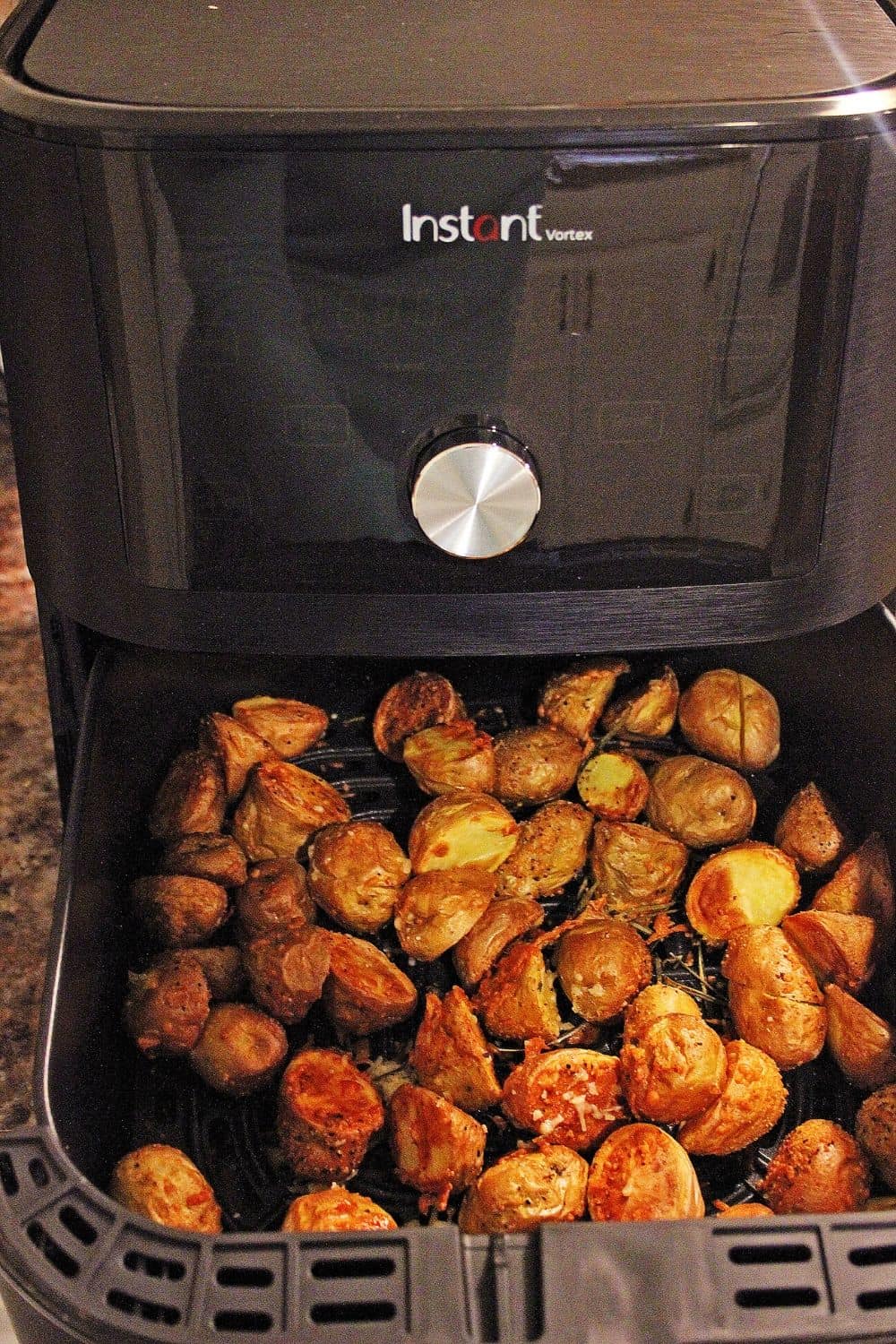 Lighten up your side dish routine with this easy Air Fryer Parmesan Rosemary Potatoes. This is a delicious weeknight or holiday side dish. We all love potato recipes and this potato recipe is quick and easy. This air fryer recipe is a healthier version of the classic roasted potatoes. Your family will love this healthy air fryer potato recipe. #potatorecipe #airfryerrecipe #airfryer #healthyrecipe