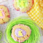 These homemade Easter Thumbprint Cookies are a sure sign of spring. Bake a batch of these easy colorful holiday cookies to share today. Everyone love thumbprint cookies!