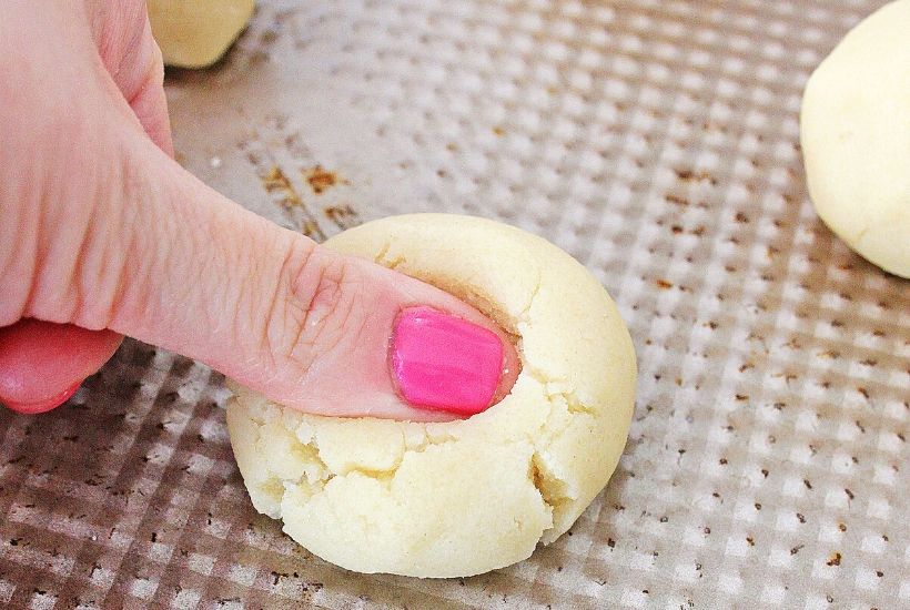 These homemade Easter Thumbprint Cookies are a sure sign of spring. Bake a batch of these easy colorful holiday cookies to share today.