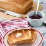 This Homemade Country White Bread makes two delicious loaves of bread. This easy bread recipe is perfect for sandwiches, toast or just a smear of butter.