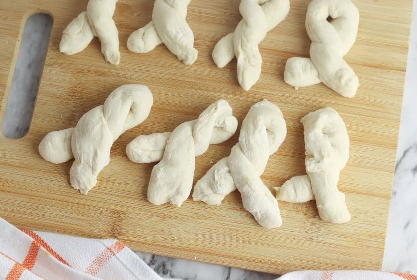 Craving a salty snack? Whip up a batch of these Easy Homemade Soft Pretzel Twists. This easy snack recipe won't last long. This basic pretzel dough recipe can be shaped into twists, knots, bites or the classic pretzel shape.