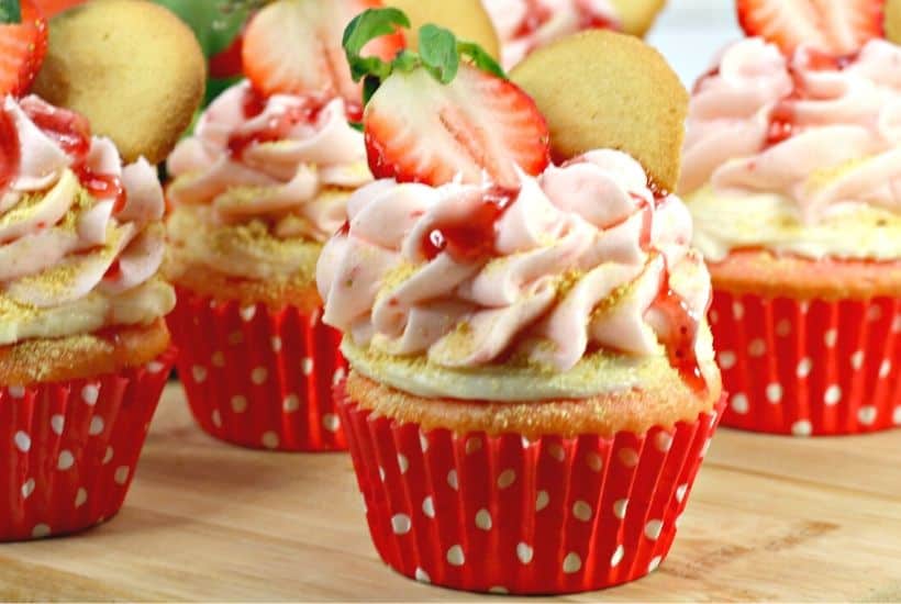 Are you fan of Strawberry cheesecake? These Strawberry cheesecake cupcakes are a fun twist on the classic. A Strawberry cupcake, fresh strawberries and a delicious cheesecake filling pair to make these delicious Strawberry Cheesecake Cupcakes. This strawberry cheesecake cupcake recipe is a real winner. Make this easy cupcake recipe for Valentine's day, birthday or just because. Celebrate strawberry season and make a batch of these pretty cupcakes.