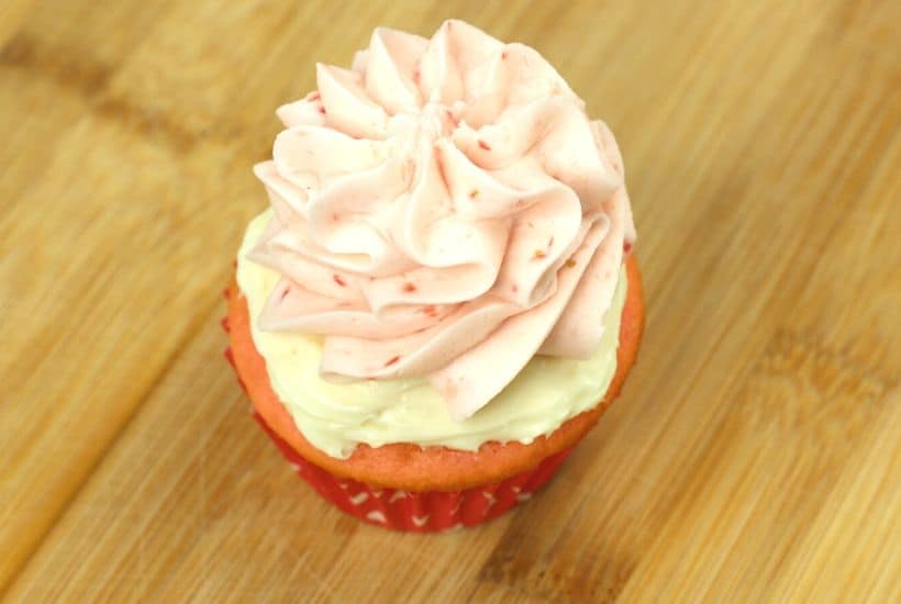 Are you fan of Strawberry cheesecake? These Strawberry cheesecake cupcakes are a fun twist on the classic. A Strawberry cupcake, fresh strawberries and a delicious cheesecake filling pair to make these delicious Strawberry Cheesecake Cupcakes. This strawberry cheesecake cupcake recipe is a real winner. Make this easy cupcake recipe for Valentine's day, birthday or just because. Celebrate strawberry season and make a batch of these pretty cupcakes.