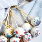 Planning a 4th of July Party or patriotic celebration. These Red White And Blue Cake Pops are a fun summer dessert recipe to make for the party. This Cake Pop recipe is a great July 4th recipe the is easy and delicious.
