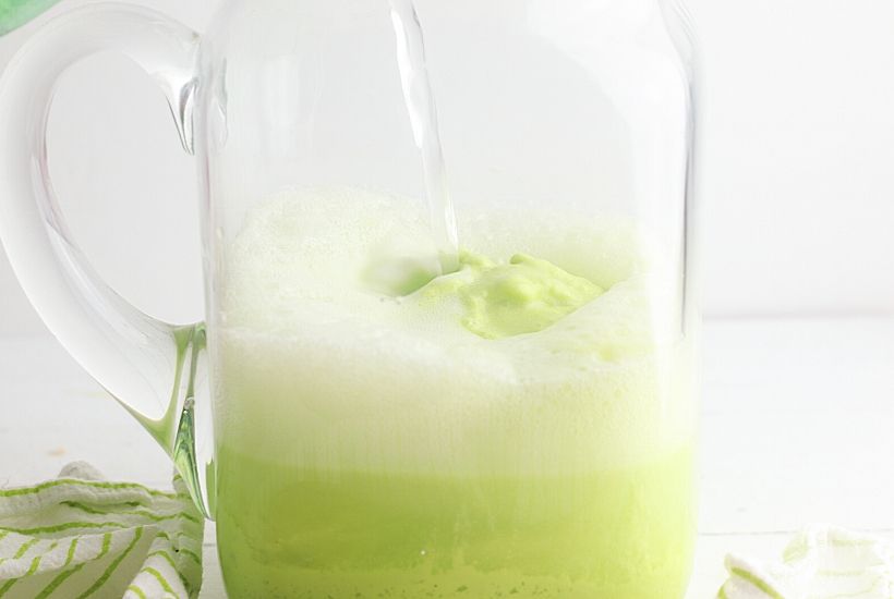 Cool off with a glass of this refreshing Frozen Limeade Punch. This is an easy frozen drink recipe that makes a great party punch too. This non-alcoholic drink recipe is the perfect mocktail for kids and adults. It is a big batch recipe so it is a perfect party drink. This limeade slushie recipe is a winner.