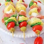 These make-ahead Tortellini Antipasto Skewers Appetizers are an easy and delicious party recipe or snack idea. This super easy antipasto recipe feeds a crowd too.