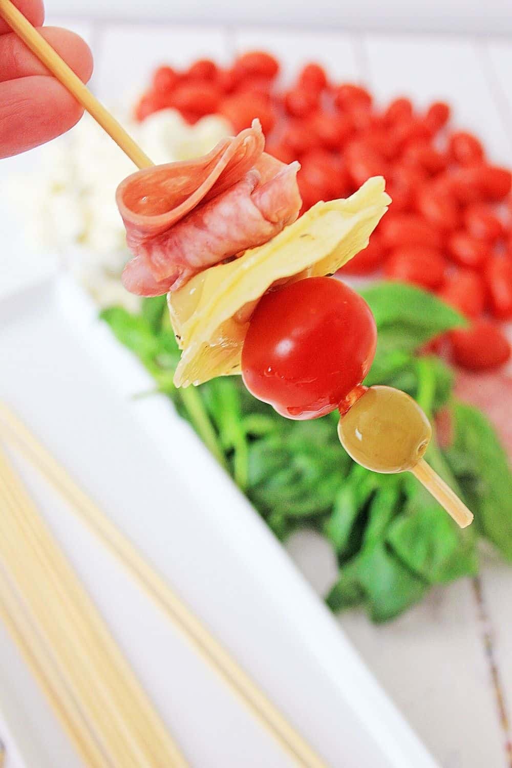 These make-ahead Tortellini Antipasto Skewers Appetizers are an easy and delicious party recipe or snack idea. This super easy antipasto recipe feeds a crowd too.