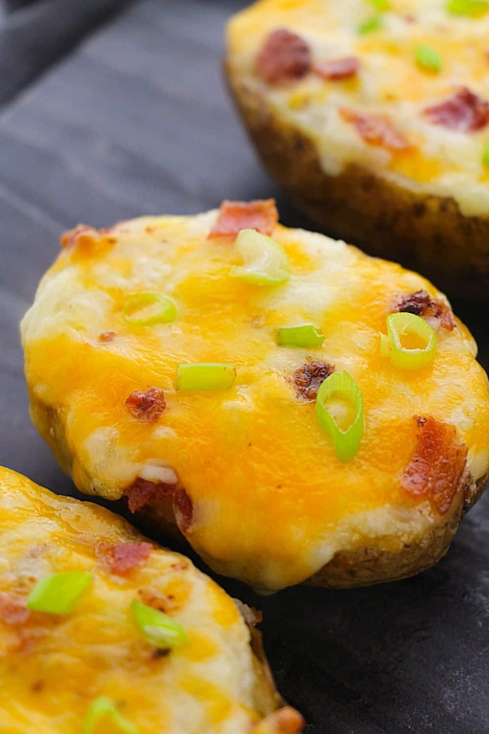 These Best Twice Baked Potatoes With Bacon are a cheesy, creamy and filled with lots of bacon. This easy potato recipe is perfectly portioned and can be made in advance.