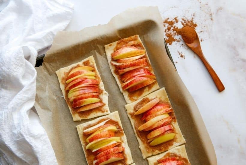 They may look fancy, but these easy puff pastry apple tarts are anything but! This easy rustic apple tarts recipe is so delicious. Fill these apple pastries with your favorite apple variety, cinnamon and sugar.