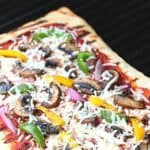 It's time to fire up the grill and turn a traditional pizza recipe into an easy and delicious Grilled Pizza. Here's How To Make the Perfect Grilled Pizza recipe.