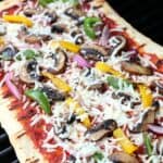 It's time to fire up the grill and turn a traditional pizza recipe into an easy and delicious Grilled Pizza. Here's How To Make the Perfect Grilled Pizza recipe.