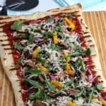 It's time to fire up the grill and turn a traditional pizza recipe into an easy and delicious Grilled Pizza. Here's How To Make the Perfect Grilled Pizza recipe.
