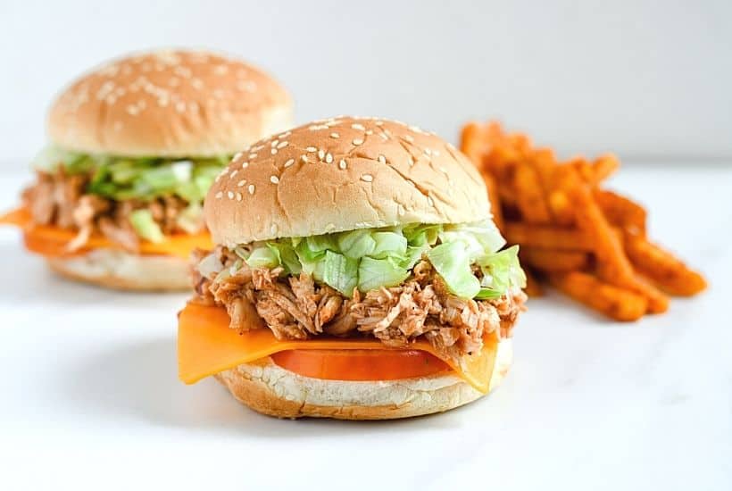 Looking for an easy weeknight meal? These Shredded BBQ Chicken Sandwiches are a delicious solution. Your family will love these barbecue chicken sandwiches. This easy sandwich recipe is great to serve at a party, football tailgate or game day celebration.