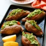 Enjoy a dairy-free and flavorful dish when preparing the Pesto Chicken Stuffed Sweet Potatoes. You can prepare this Whole 30 recipe in less than two hours. You will love how easy this sweet potato recipe is to make. This baked sweet potatoes recipe is so delicious.