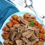 Bring the taste of comfort food home with this classic Crock Pot Beef Roast recipe. The hearty meal cooks at a steady pace in the slow cooker to provide a meal that will melt in your mouth. This easy slow cooker pot roast recipe is loaded with carrots, potatoes and onions. No need to turn the oven on with the easy Crock Pot Pot Roast recipe.