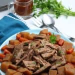 Bring the taste of comfort food home with this classic Crock Pot Beef Roast recipe. The hearty meal cooks at a steady pace in the slow cooker to provide a meal that will melt in your mouth. This easy slow cooker pot roast recipe is loaded with carrots, potatoes and onions. No need to turn the oven on with the easy Crock Pot Pot Roast recipe.