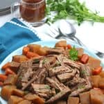 Bring the taste of comfort food home with this classic Crock Pot Beef Roast recipe. The hearty meal cooks at a steady pace in the slow cooker to provide a meal that will melt in your mouth. This easy slow cooker pot roast recipe is loaded with carrots, potatoes and onions. No need to turn the oven on with the easy Crock Pot Pot Roast recipe.
