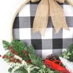 It's not a farmhouse Christmas without buffalo plaid and a vintage red truck. This Buffalo Plaid Christmas Hoop Wreath is an easy farmhouse Christmas craft. This DIY Christmas wreath is an easy Christmas craft. If you love farmhouse style design, this is a perfect Christmas project to make for your home.
